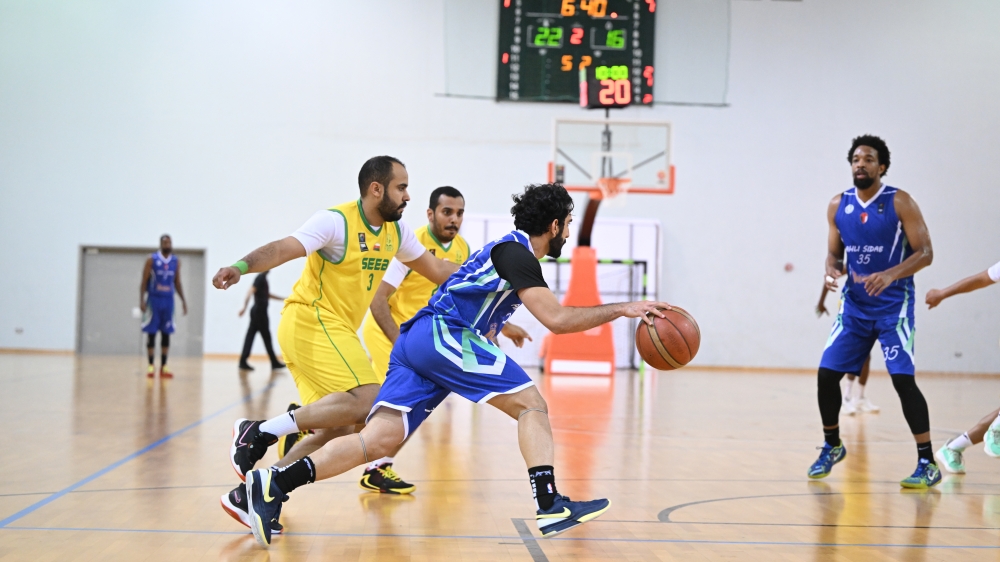 Seeb and Ahli Sidab players in action during the Oman Basketball League. -- 