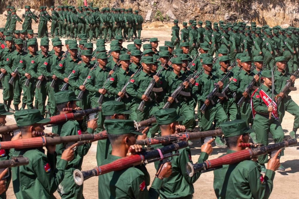 Members of the Mandalay People's Defense Forces marching in a graduation ceremony after training at a camp in an undisclosed location in Myanmar's northern Shan State. — AFP