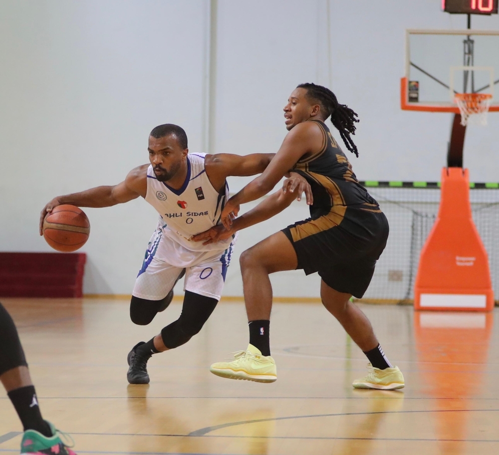 Al Bashayer and Ahli Sidab players in action during the Oman Basketball League.