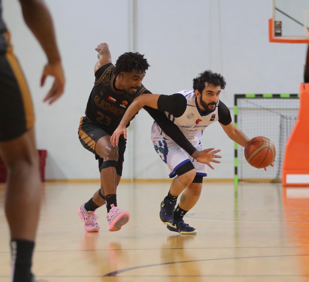 Al Bashayer and Ahli Sidab players in action during the Oman Basketball League.
