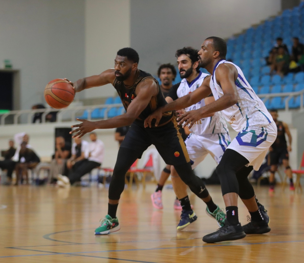 Al Bashayer and Ahli Sidab players in action during the Oman Basketball League.