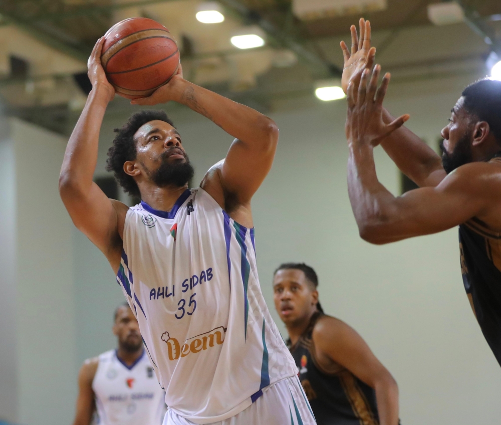 Al Bashayer and Ahli Sidab players in action during the Oman Basketball League.