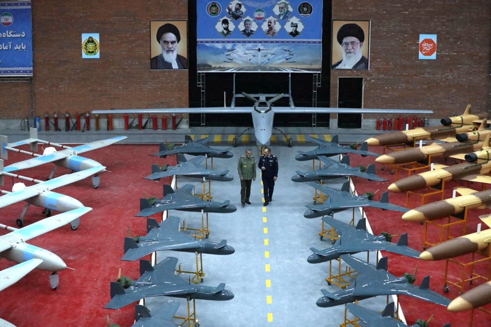 Commander-in-Chief of Iran's Army, Abdolrahim Mousavi visits drones during a ceremony of the joining new drones. — AFP 