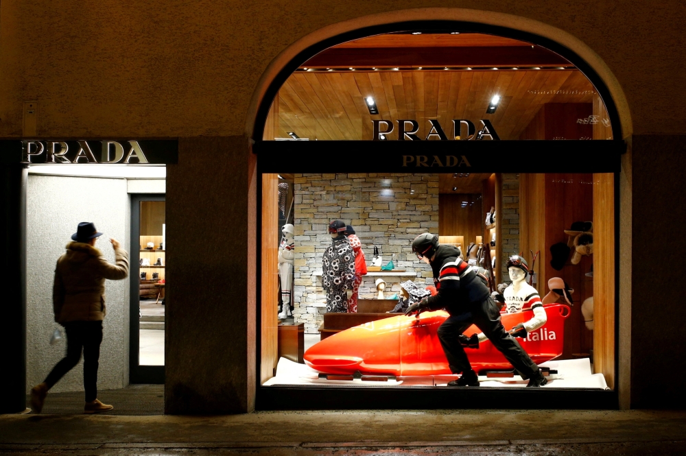 FILE PHOTO: A bobsleigh is used as decoration at a Prada store in the Alpine resort of St. Moritz, Switzerland January 15, 2022. REUTERS/Arnd Wiegmann/File Photo
