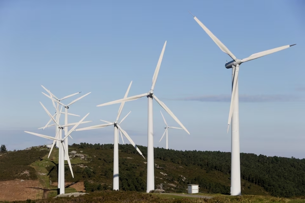 Wind turbines operate at a wind farm in Dumbria, near Finisterre, Galicia, Spain. — Reuters