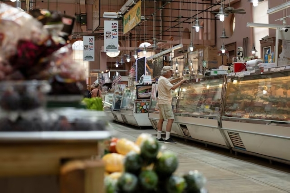 A man shops for meat at Eastern Market in Washington, US. — Reuters