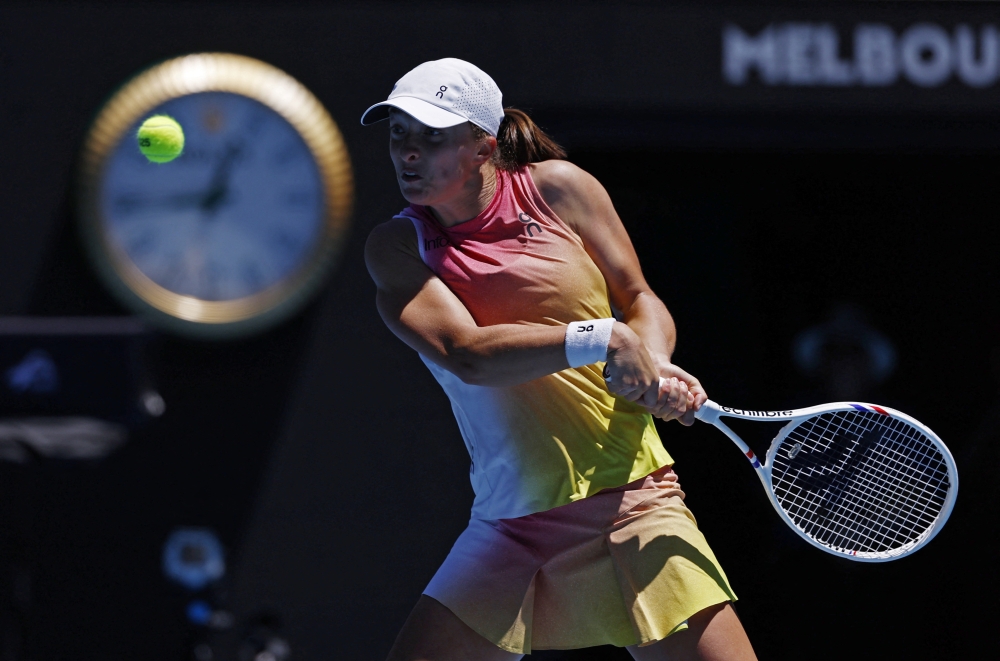 Tennis - Australian Open - Melbourne Park, Melbourne, Australia - January 16, 2025 Poland's Iga Swiatek in action during her second round match against Slovakia's Rebecca Sramkova REUTERS/Tingshu Wang
