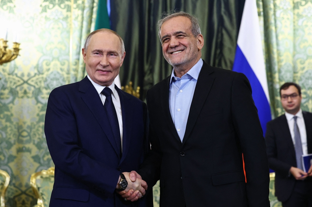 Russian President Vladimir Putin and Iranian President Masoud Pezeshkian during a meeting at the Kremlin in Moscow