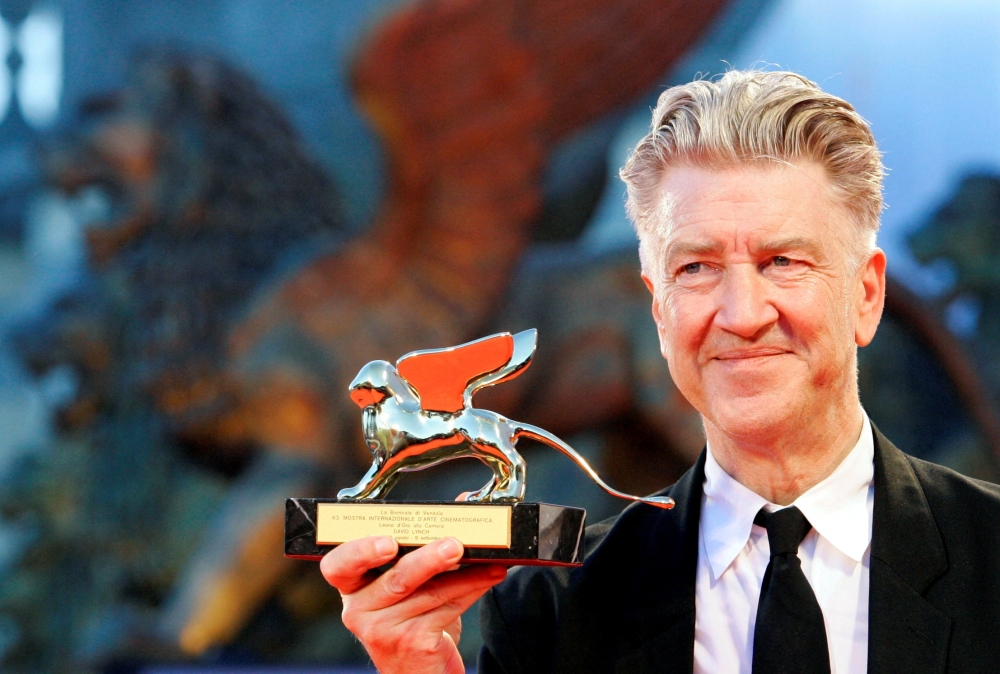 David Lynch poses with the Golden Lion award for lifetime achievement at the Venice Film Festival in 2006 