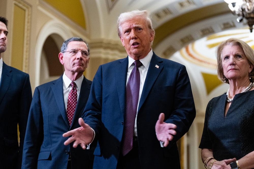 President-elect Donald Trump speaks to reporters at the Capitol in Washington, Jan. 8, 2025. (Eric Lee/The New York Times)