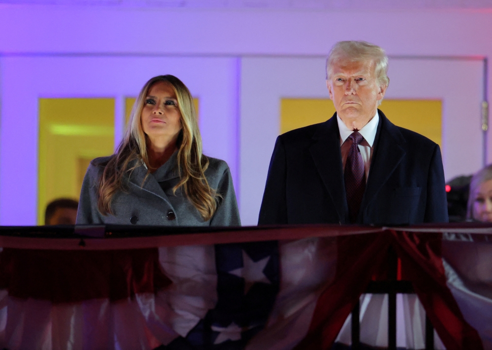 US President-elect Donald Trump and Melania Trump watch a fireworks display ahead of the inauguration, at Trump National Golf Club Washington DC in Sterling, Virginia, US. — Reuters 