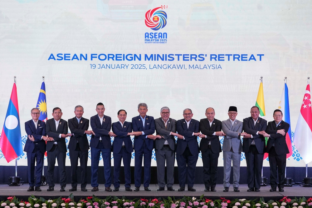 Delegates pose for a group photo during the ASEAN Foreign Ministers' Retreat (AMM) in Langkawi, Malaysia. — Reuters 