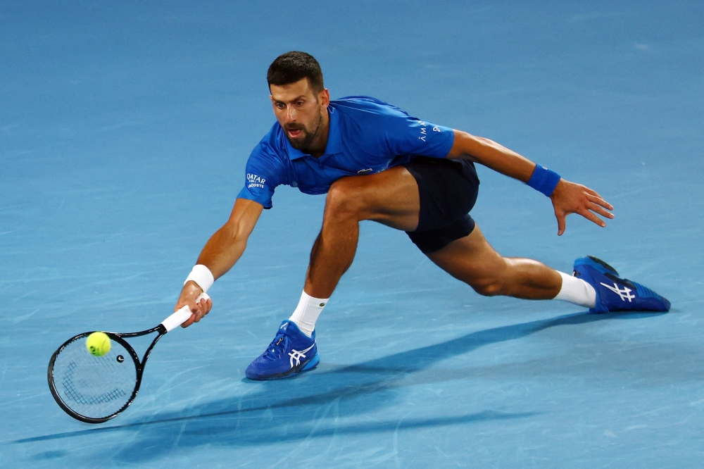 Tennis - Australian Open - Melbourne Park, Melbourne, Australia - January 19, 2025 Serbia's Novak Djokovic in action during his fourth round match against Czech Republic's Jiri Lehecka REUTERS/Edgar Su
