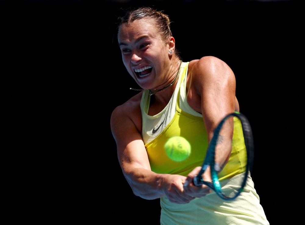Tennis - Australian Open - Melbourne Park, Melbourne, Australia - January 19, 2025 Belarus' Aryna Sabalenka in action during her fourth round match against Russia's Mirra Andreeva REUTERS/Edgar Su     TPX IMAGES OF THE DAY
