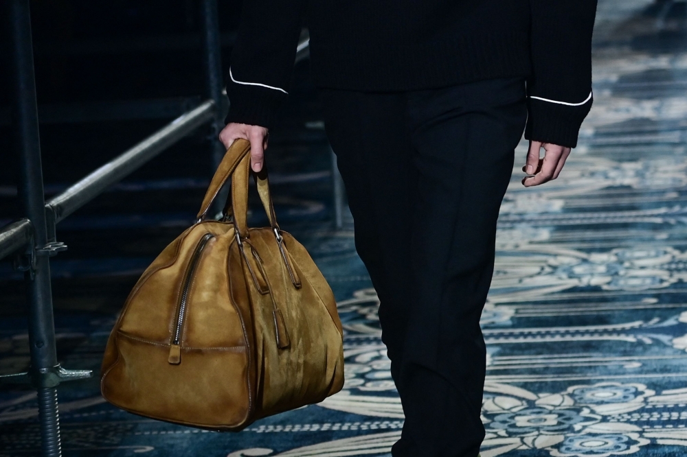 A model walks the runway during the Prada collection show at Milan's Fashion Week Men's Fall / Winter 2025-2026 in Milan, Italy, on January 19, 2025 (Photo by Piero CRUCIATTI / AFP)

