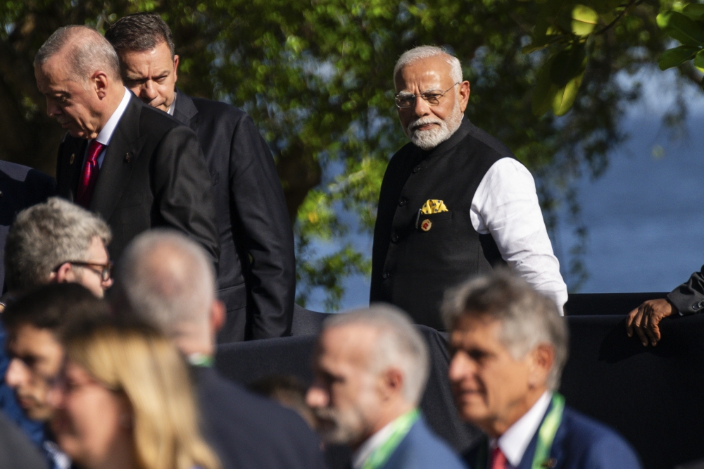 Prime Minister of India Narendra Modi walks after a group official photo at the G20 Summit in Rio de Janeiro, Nov. 18, 2024. (Eric Lee/The New York Times)