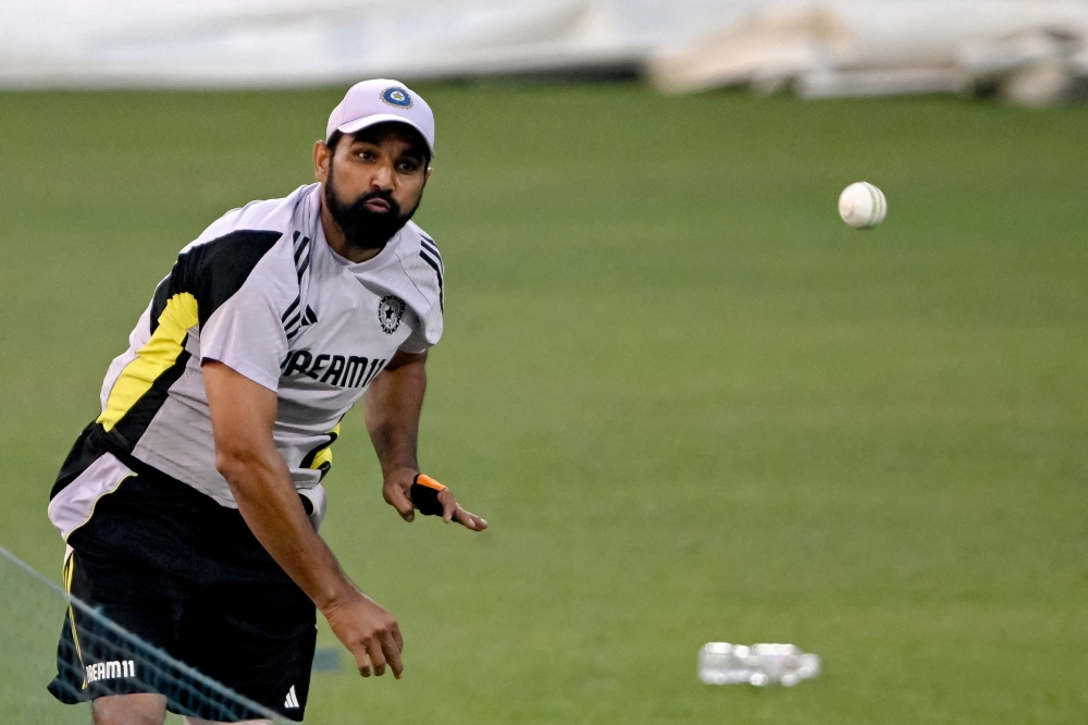 India's Mohammed Shami bowls in the nets during a practice session ahead of their first Twenty20 international cricket match against England at the Eden Gardens in Kolkata on January 19, 2025.  (Photo by Dibyangshu SARKAR / AFP)

