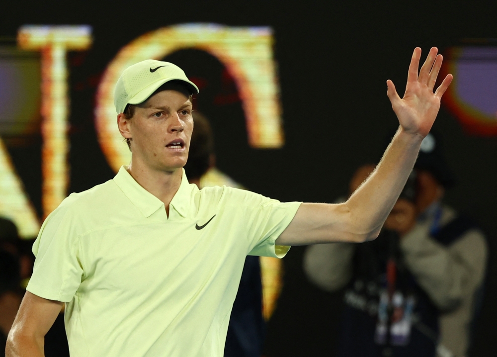 Tennis - Australian Open - Melbourne Park, Melbourne, Australia - January 22, 2025 Italy's Jannik Sinner celebrates after winning his quarter final match against Australia's Alex de Minaur REUTERS/Edgar Su
