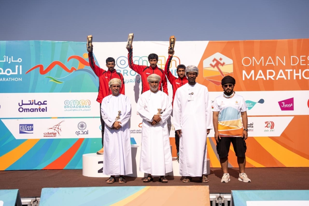 Omani category winners pose with their trophies.