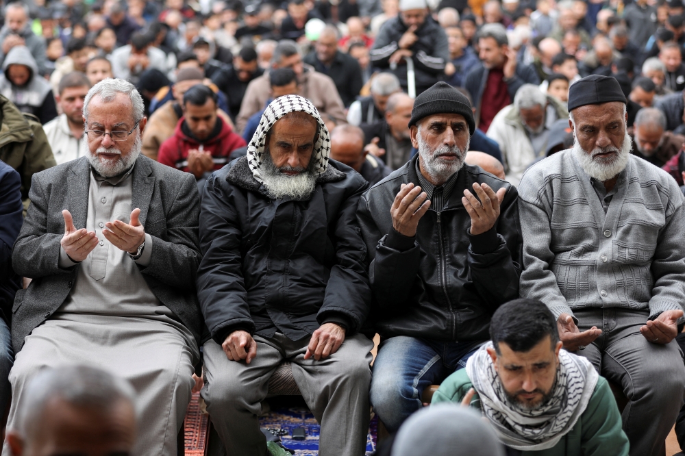 Palestinians attend the funeral of Rawhi Mushtaha, a senior Hamas official and Sami Odeh, Hamas' general security service commander, who were killed in an Israeli strike during the war, in Gaza City. - Reuters