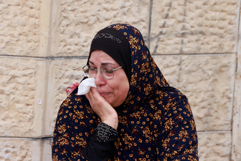 A Palestinian woman reacts during a large-scale Israeli army raid in Jenin in the occupied West Bank