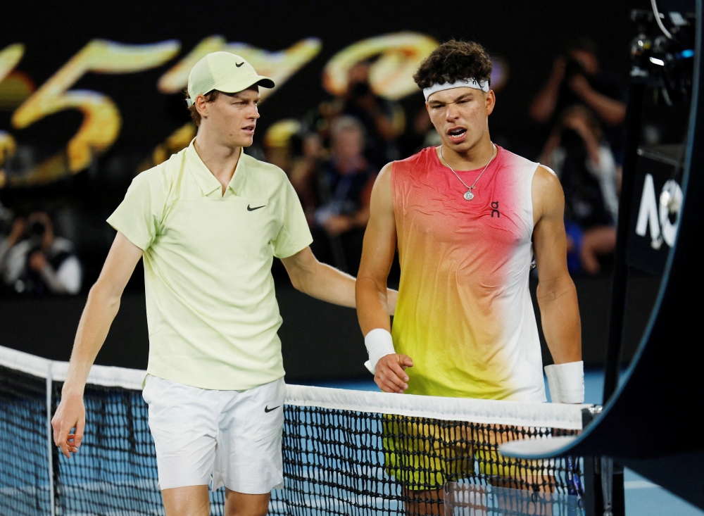 Italy's Jannik Sinner with Ben Shelton of the US after winning their semi final match 
