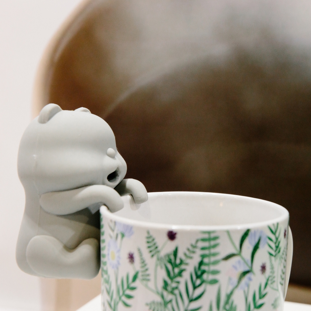 A cat-shaped robot by Yukai Engineering, a Tokyo start-up, is displayed on the edge of a cup to blow air and cool off drinks, at CES