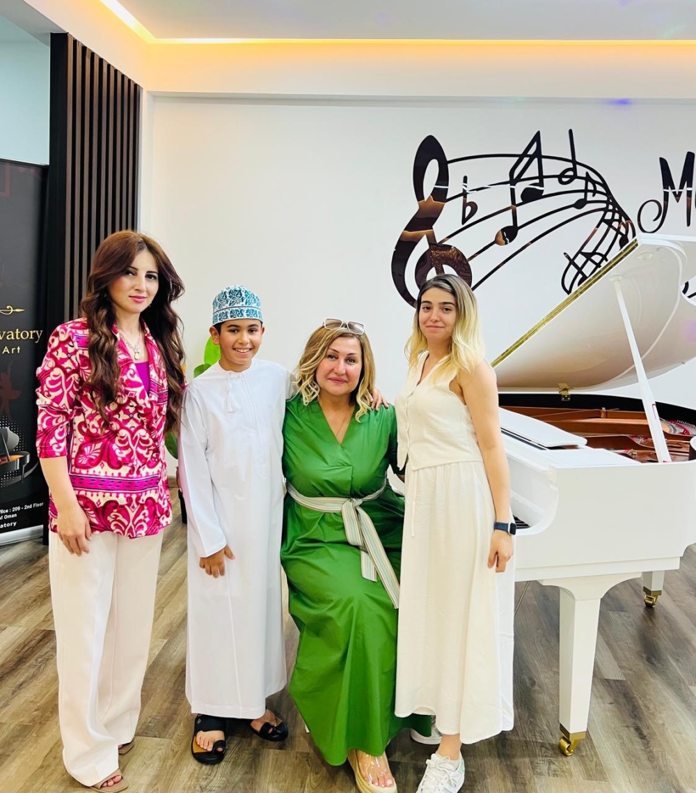 Sulaiman Al Fahdi  with his teacher Dr Saida Khalilova and others