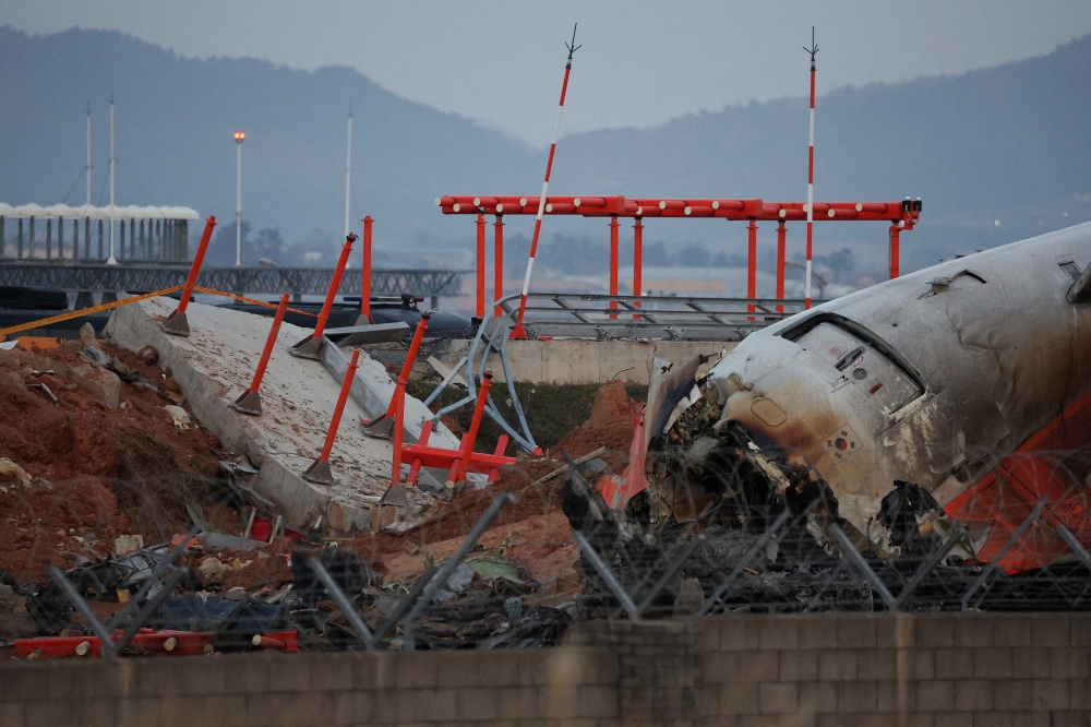 The wreckage of the Jeju Air aircraft that went off the runway and crashed at Muan International Airport 