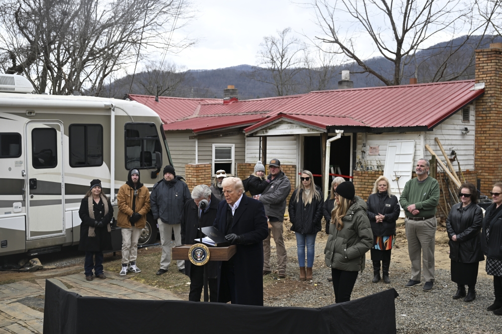 President Donald Trump delivers remarks outside a home destroyed by Hurricane Helene in Swannanoa, N.C., on Friday, Jan. 24, 2025. (Kenny Holston/The New York Times)