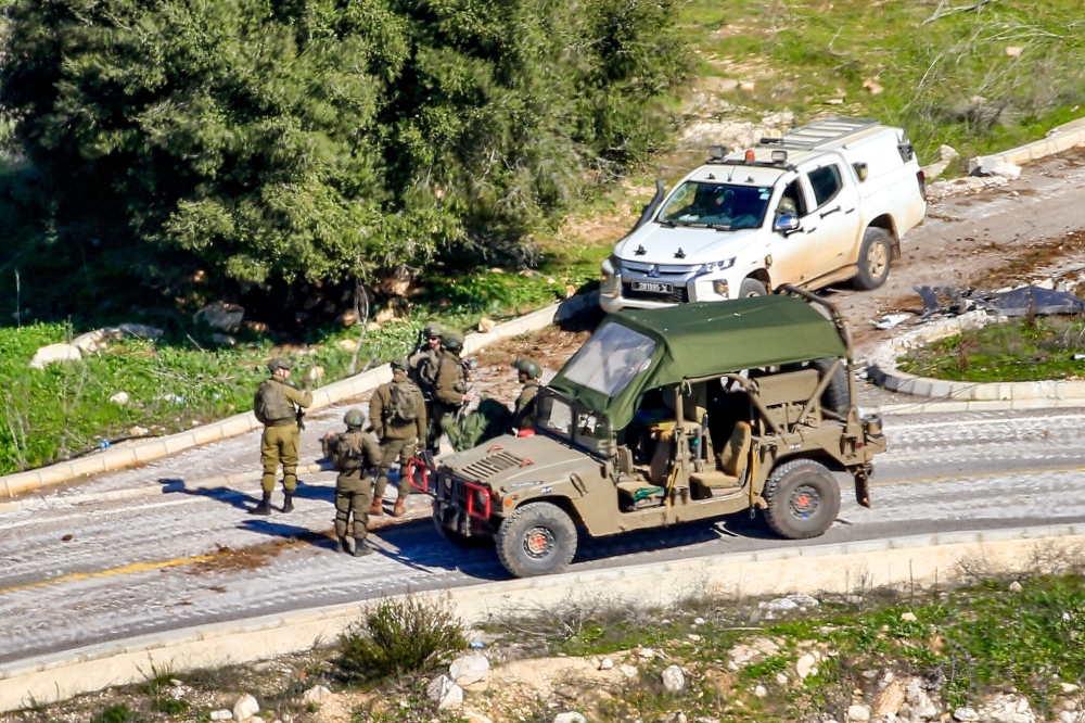 This picture shows Israeli army soldiers at the entrance of the village of Hula along the border with Israel in south Lebanon. — AFP 
