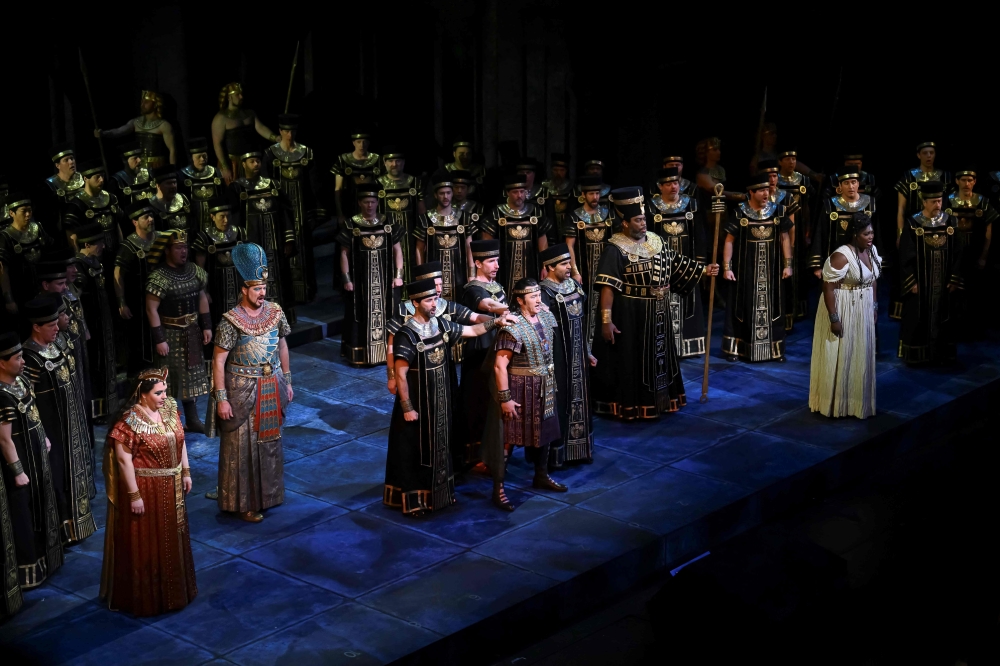 Opera singers and actors perform during Giuseppe Verdi痴 "Aida" at New York's Metropolitan Opera on January 14, 2025.  "Aida" has long epitomized opera at its most extravagant -- think sweeping sets, luxurious costumes and even real-live horses, an experience intended to transfix the audience with grandeur. A beloved version of that scale helmed the Met for more than three decades -- so staging a new production of "Aida," a tale of love, war and loyalty set in ancient Egypt, was a tall order. "Because Aida is so big and so expensive... I did definitely feel the pressure of that," director Michael Mayer told AFP in a recent interview of his production that premiered this month, adding that "I knew that there were audiences who wanted the big spectacle."
 (Photo by ANGELA WEISS / AFP)

