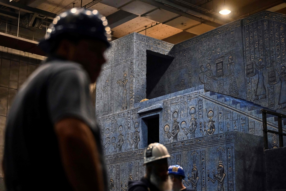 Stage hands work backstage for Giuseppe Verdi痴 "Aida" at New York's Metropolitan Opera on January 14, 2025.  "Aida" has long epitomized opera at its most extravagant -- think sweeping sets, luxurious costumes and even real-live horses, an experience intended to transfix the audience with grandeur. A beloved version of that scale helmed the Met for more than three decades -- so staging a new production of "Aida," a tale of love, war and loyalty set in ancient Egypt, was a tall order. "Because Aida is so big and so expensive... I did definitely feel the pressure of that," director Michael Mayer told AFP in a recent interview of his production that premiered this month, adding that "I knew that there were audiences who wanted the big spectacle."
 (Photo by ANGELA WEISS / AFP)

