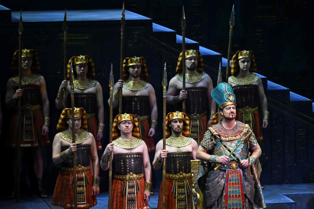 Performers are seen on stage during Giuseppe Verdi痴 "Aida" at New York's Metropolitan Opera on January 14, 2025.  "Aida" has long epitomized opera at its most extravagant -- think sweeping sets, luxurious costumes and even real-live horses, an experience intended to transfix the audience with grandeur. A beloved version of that scale helmed the Met for more than three decades -- so staging a new production of "Aida," a tale of love, war and loyalty set in ancient Egypt, was a tall order. "Because Aida is so big and so expensive... I did definitely feel the pressure of that," director Michael Mayer told AFP in a recent interview of his production that premiered this month, adding that "I knew that there were audiences who wanted the big spectacle."
 (Photo by ANGELA WEISS / AFP)

