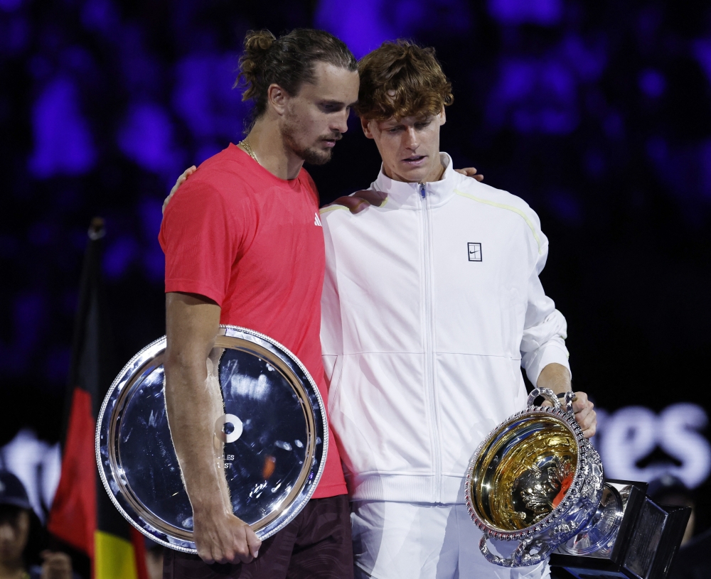 Italy's Jannik Sinner poses with the trophy alongside Germany's Alexander Zverev after the final.— Reuters