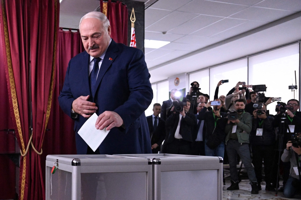 Belarusian President Alexander Lukashenko casts his ballot at a polling station in the capital Minsk. — AFP 