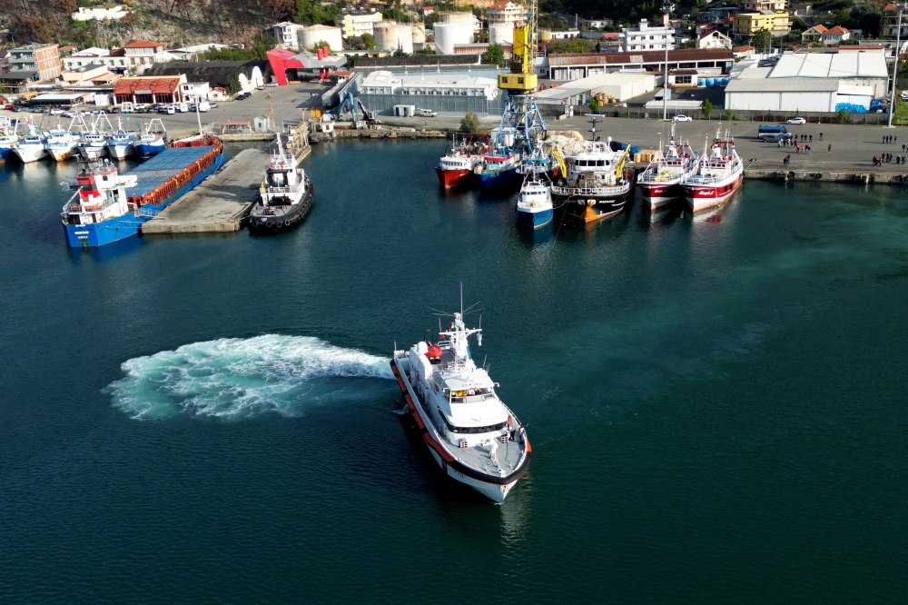 A drone view shows an Italian coast guard vessel departing with migrants, in Shengjin, Albania. — Reuters file photo 