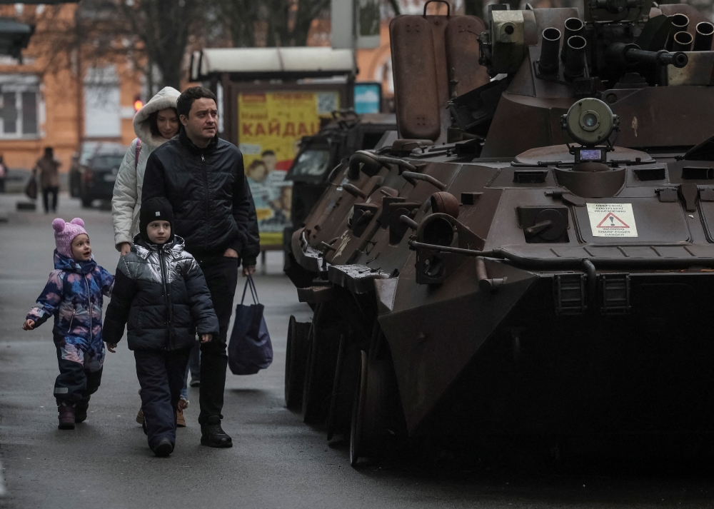 People walk past at a street exhibition displaying destroyed Russian military vehicles, in Kyiv, Ukraine. — Reuters 