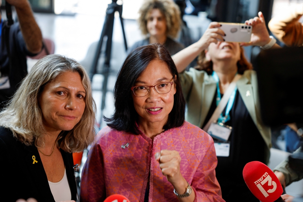 Ambassador of Thailand in Israel Pannabha Chandraramya with Osnat Levtzion-Korach, General Director of Shamir Medical Center, as she speaks to the press while awaiting the release of Thai hostages seized during the attack by Hamas at Shamir Medical Center in Beer Yaakov. — Reuters