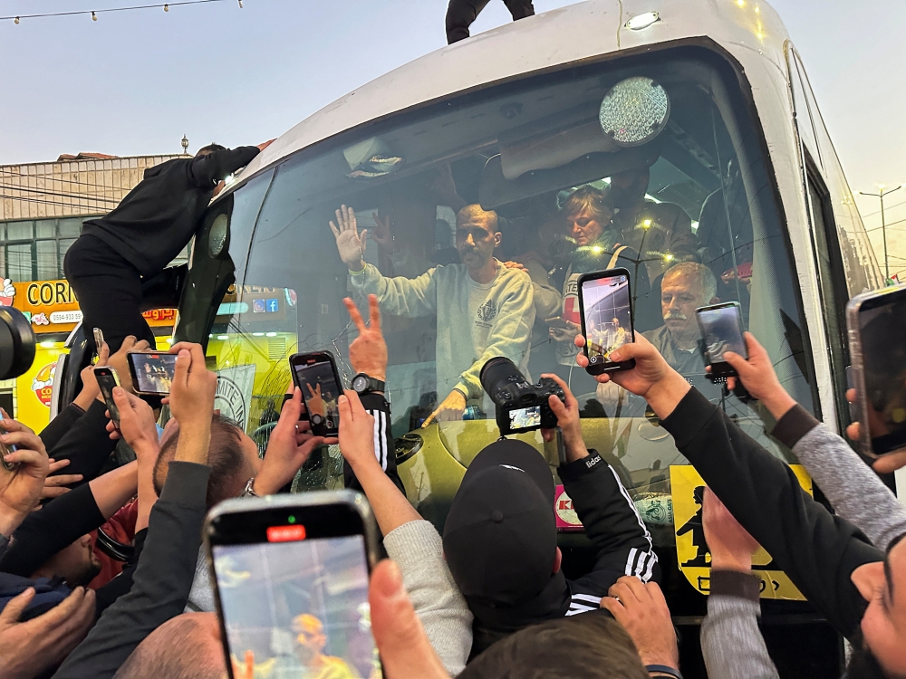 Zakaria Zubeidi, a former high-profile commander, gestures while in a vehicle, near Ramallah in the Israeli occupied West Bank, on Thursday. - Reuters