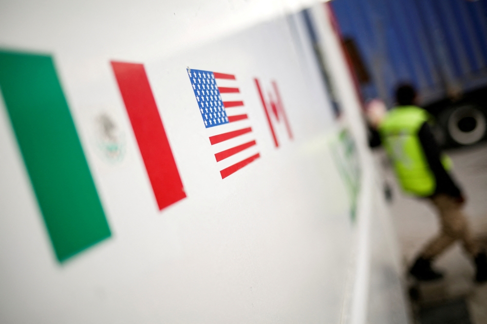 Flags of Mexico, US and Canada are pictured at a security booth at Zaragoza-Ysleta border crossing bridge, in Ciudad Juarez 