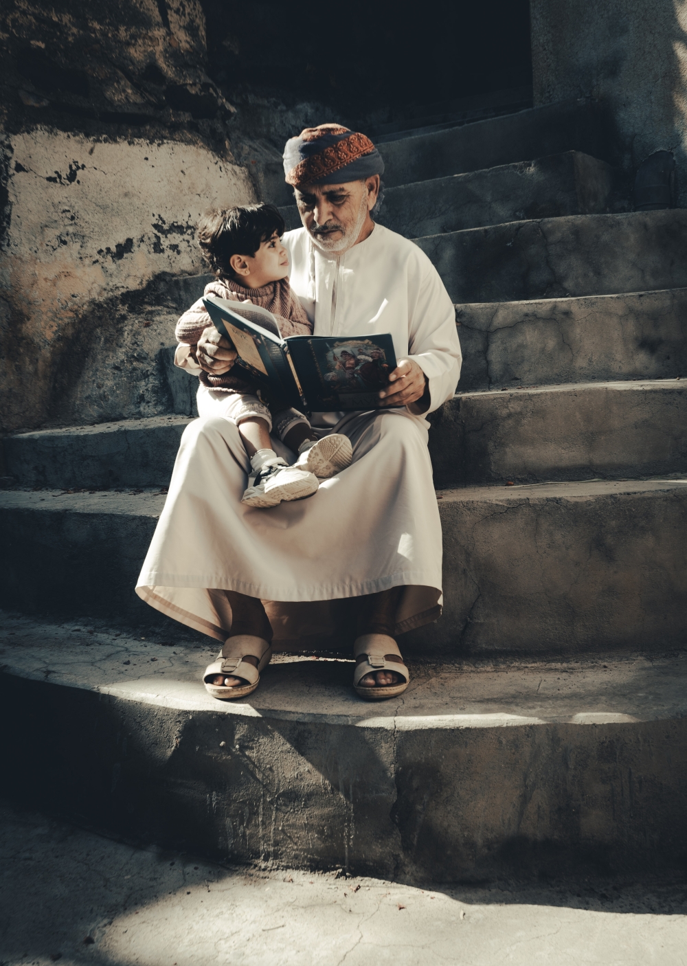A man and his son in Misfah
