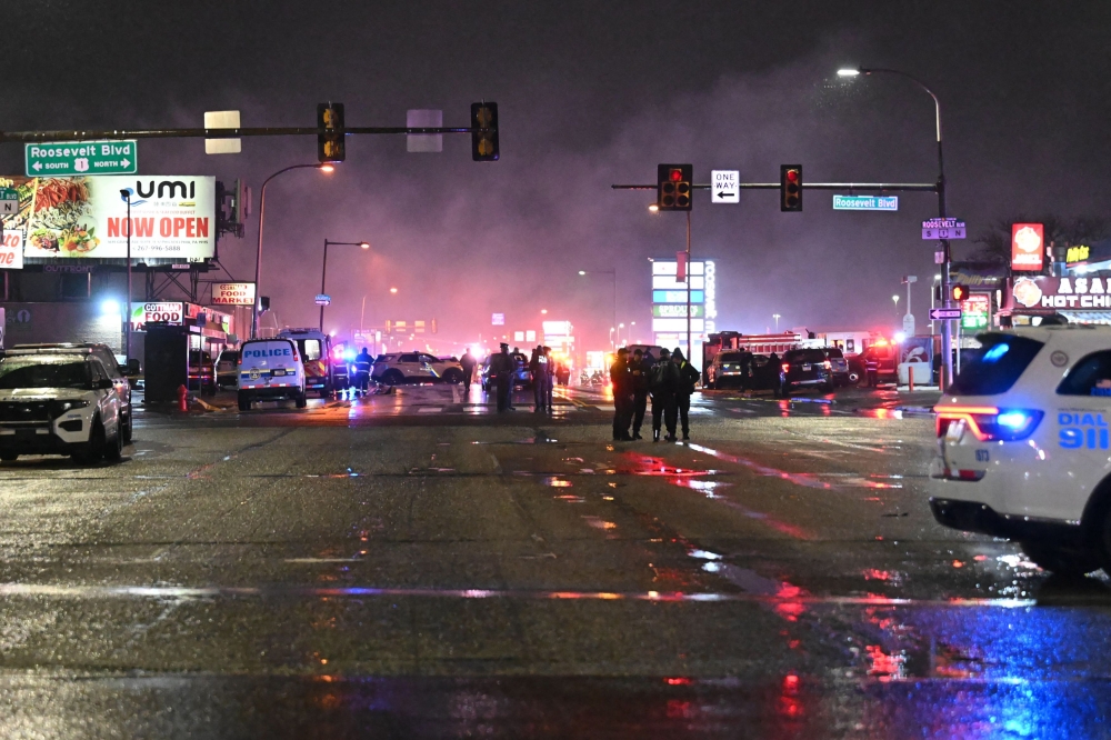Emergency responders work the scene after a small aircraft crashed in a neighborhood in Northeast Philadephia, Pennsylvania on January 31, 2025.