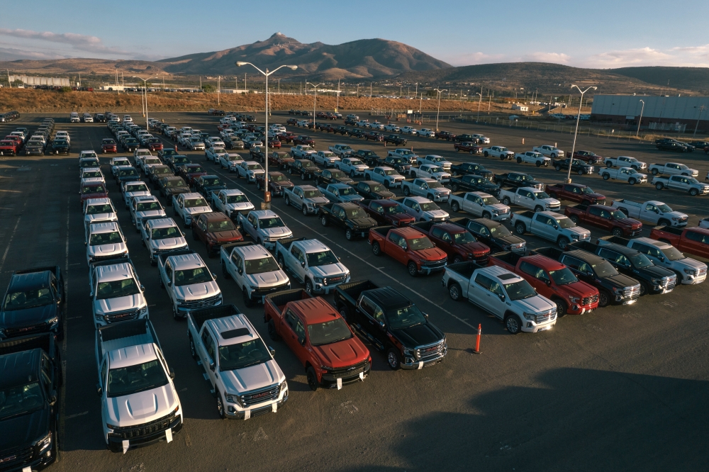 Chevy and GMC pickup trucks at the General Motors facility in Silao, Mexico, on Jan. 25, 2022. (Luis Antonio Rojas/The New York Times)