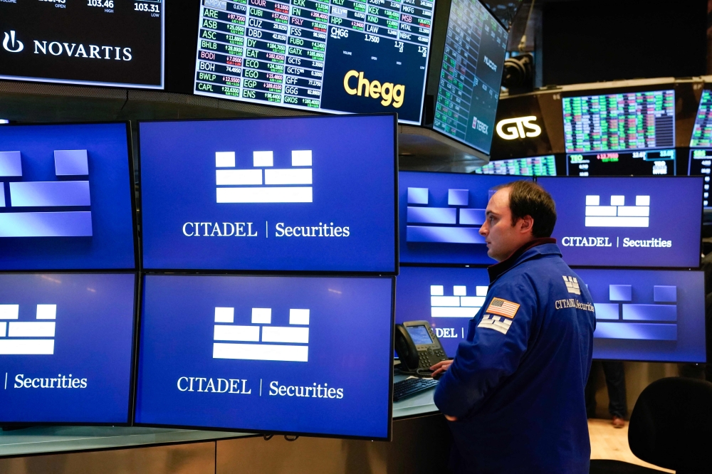 Traders work on the floor of the New York Stock Exchange (