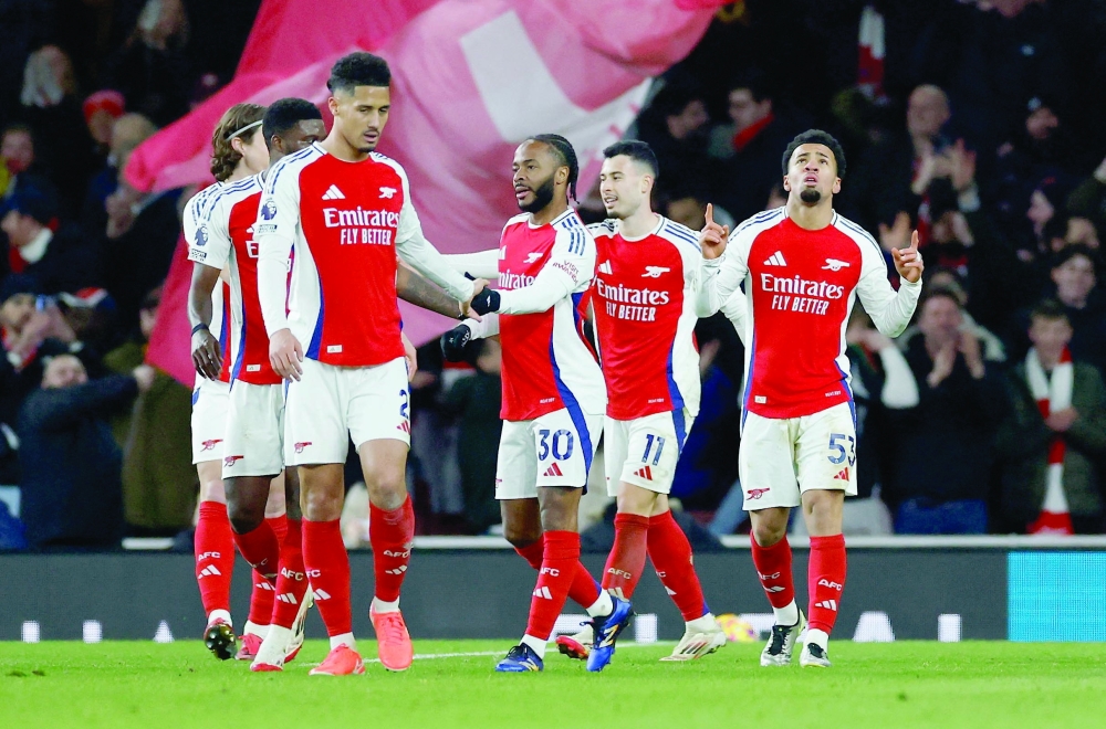 Soccer Football - Premier League - Arsenal v Manchester City - Emirates Stadium, London, Britain - February 2, 2025 Arsenal's Ethan Nwaneri celebrates scoring their fifth goal with teammates Action Images via Reuters