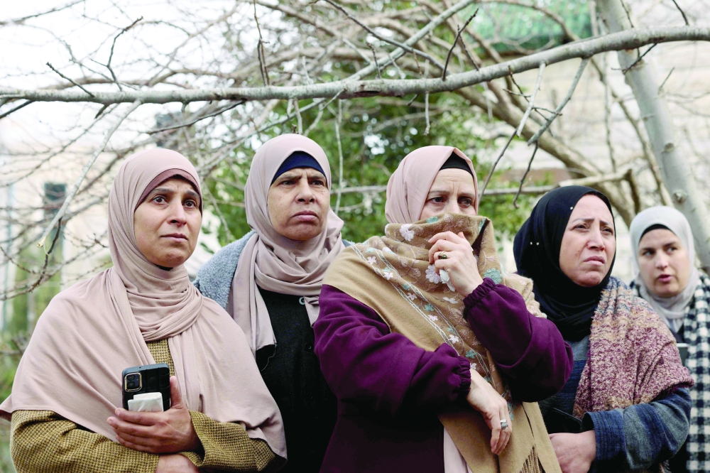 Mourners attend the funeral of a Palestinian, who was killed during clashes with Israeli forces, at the al-Aroub camp, in the West Bank. — AFP 