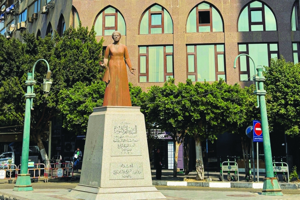A statue of the late Egyptian singer Umm Kulthum stands in the Zmalek district of Cairo on January 28, 2025. Umm Kulthum passed away in February 1975 but remains one of the most revered legends of music in the Arab world 50 years after her death, in Kuwait City. (Photo by Khaled DESOUKI / AFP)