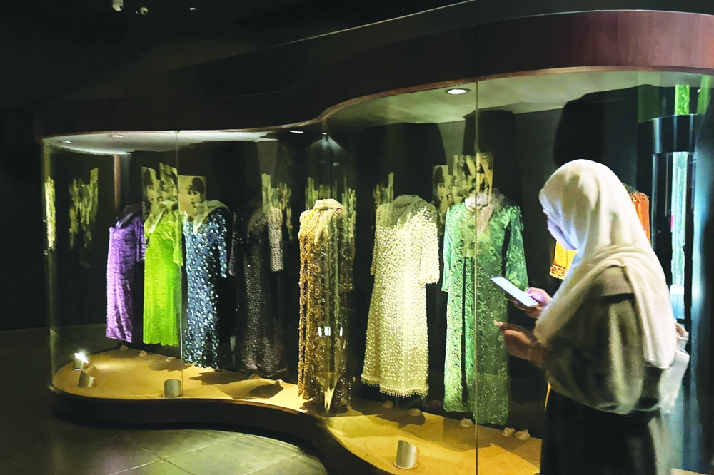 A visitor enters the room displaying stage dresses worn by the late Egyptian singer Umm Kulthum, inside the biographical museum dedicated to her in Cairo on January 29, 2025. Umm Kulthum passed away in February 1975 but remains one of the most revered legends of music in the Arab world 50 years after her death, in Kuwait City. (Photo by Khaled DESOUKI / AFP)