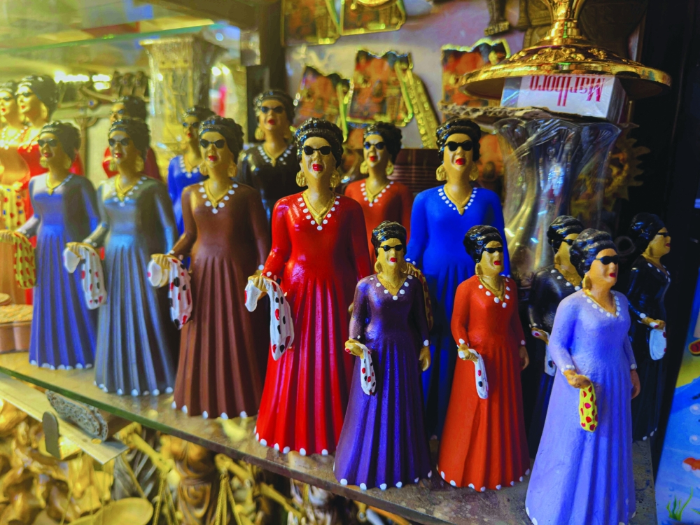 Statuettes of late Egyptian singer, songwriter and film actress Umm Kulthum are displayed at a bazaar in the Khan al-Khalili historical area in the heart of the Egyptian capital Cairo on January 28, ahead of the 50th anniversary of her death next month.  (Photo by Khaled DESOUKI / AFP)